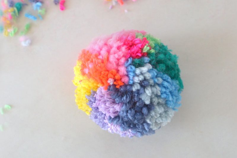 Make an almost perfect rainbow pom-pom with this simple DIY.